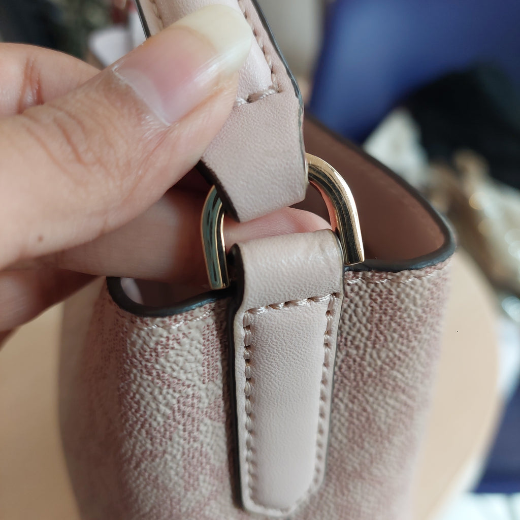 Michael Kors Powder Blush Monogrammed Canvas 'Suri' Small Bucket Bag | Gently Used |